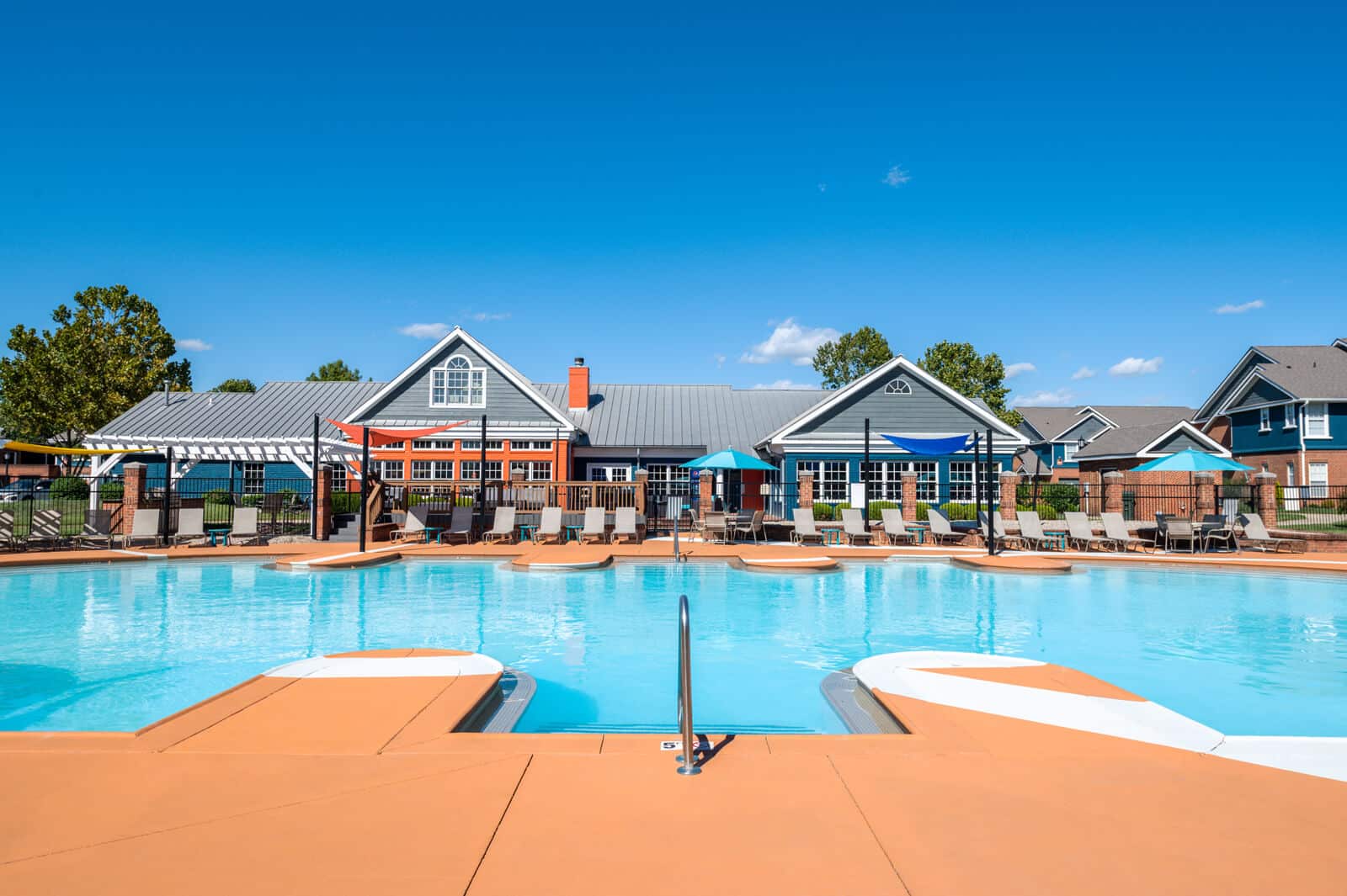 Relax poolside at the resort-style pool at The Paddock at Eastpoint Apartments.
